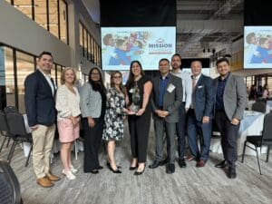 Neighbrohood Healthcare accepts Vibrant Health Award from IEHP